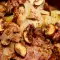Свиная шейка с луком и грибами в глиняном горшке