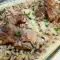 Свиная рулька с рисом и грибами в духовке