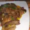 Свиное сердце с грибами и овощами на сковороде